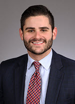 Young male lawyer head shot Justin Scott