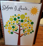 Tree with leaves painted on a whiteboard, allowing people to write bucket list items on it