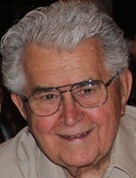 Picture of the authors father, he has grey hair, glasses and a beautiful smile