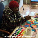 African American woman painting at ARTZ Philadelphia