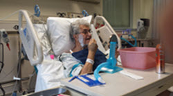 man in hospital shaving