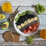 Healthy food on a table avacado whole grain bread fruit and vegetables