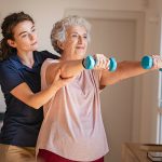 Senior working with physical therapist
